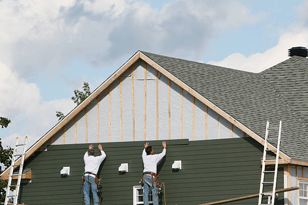 Professional Storm Damage Siding Repair technician working in Windham, OH